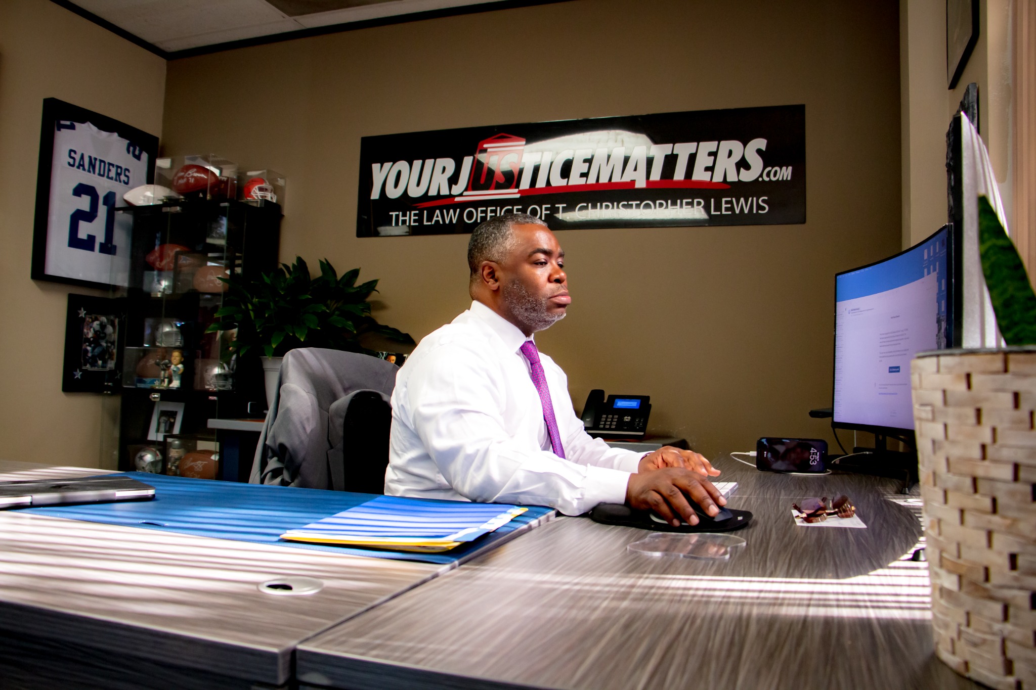 T. Christopher Lewis working at his computer